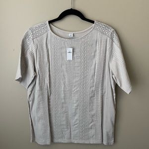 NWT Large cream short sleeve shirt with lace detail on front and sleeves